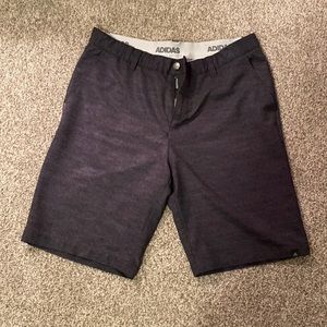 Gray Adidas golf shorts.